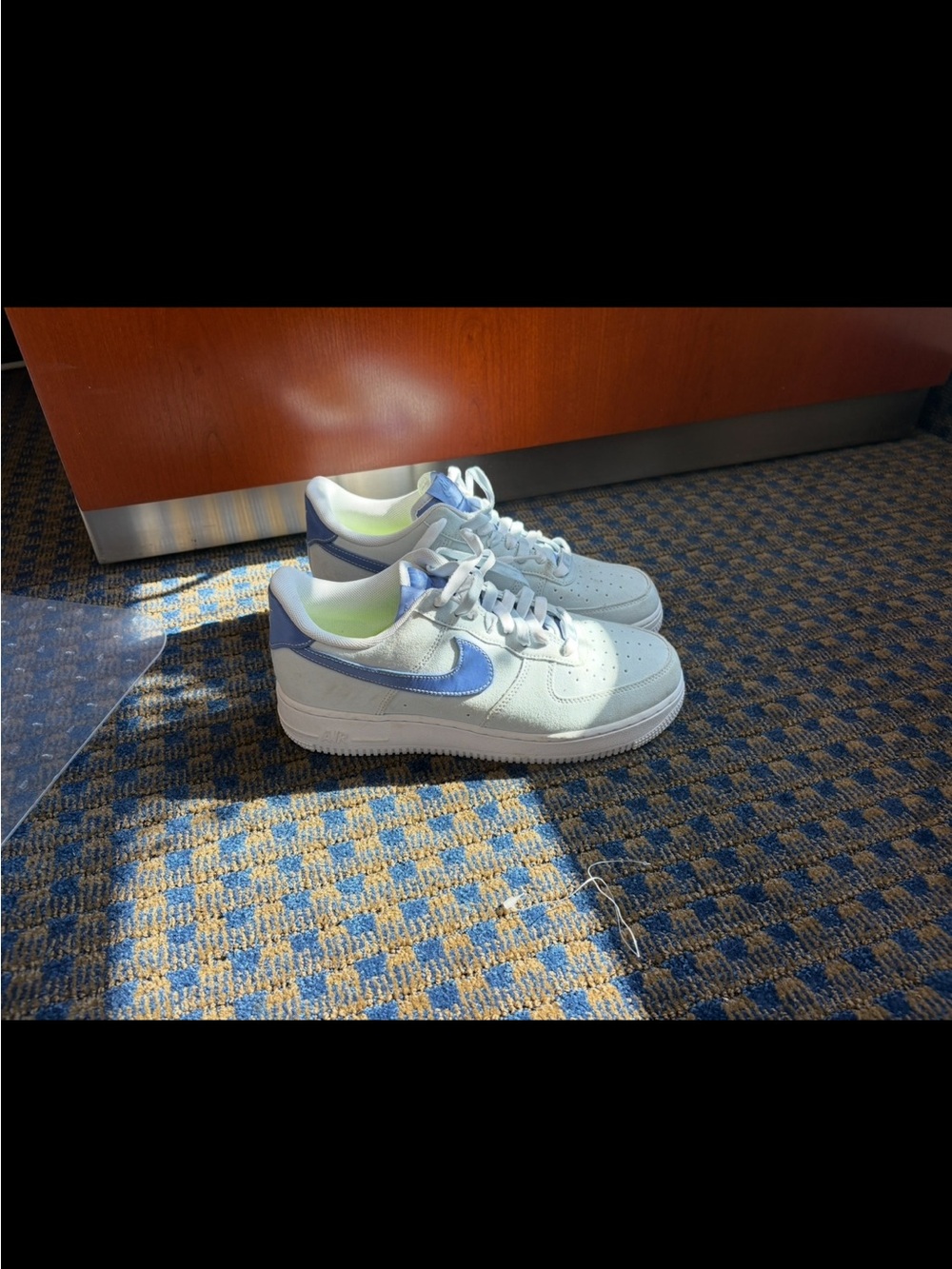Nike Air Force 1 Women’s Low-Top Sneakers in White with Blue Swoosh